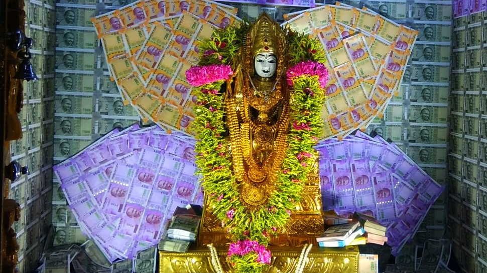 Image result for Idol in Coimbatore Muthumariamman temple decorated with currency notes, diamonds