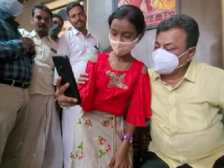 Karnataka MLA renukacharya posing for selfie with child