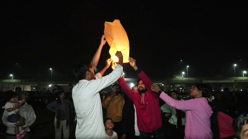 Happy New Year Despite the cold people celebrated by launching hot air balloons on the beach in Karwar
