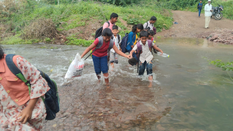 school children in athani risk lives crossing overflowing stream parents demand road connectivity athani belagavi